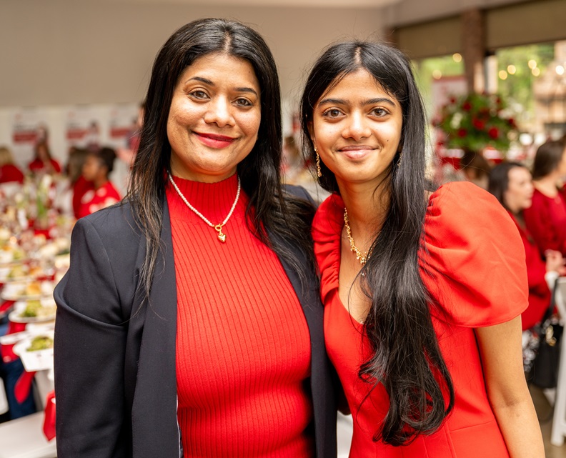 Two women dressed in red.